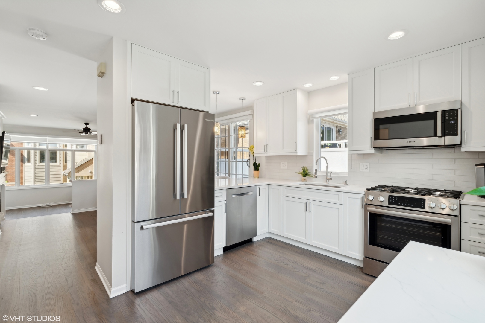 1251 West Fletcher Street, Unit E Chicago, IL 60657 - Photo 6 of 20 a kitchen with a refrigerator stove and microwave