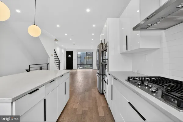 a kitchen with a stove and a sink