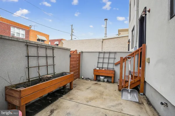 a wooden bench sitting in front of a building