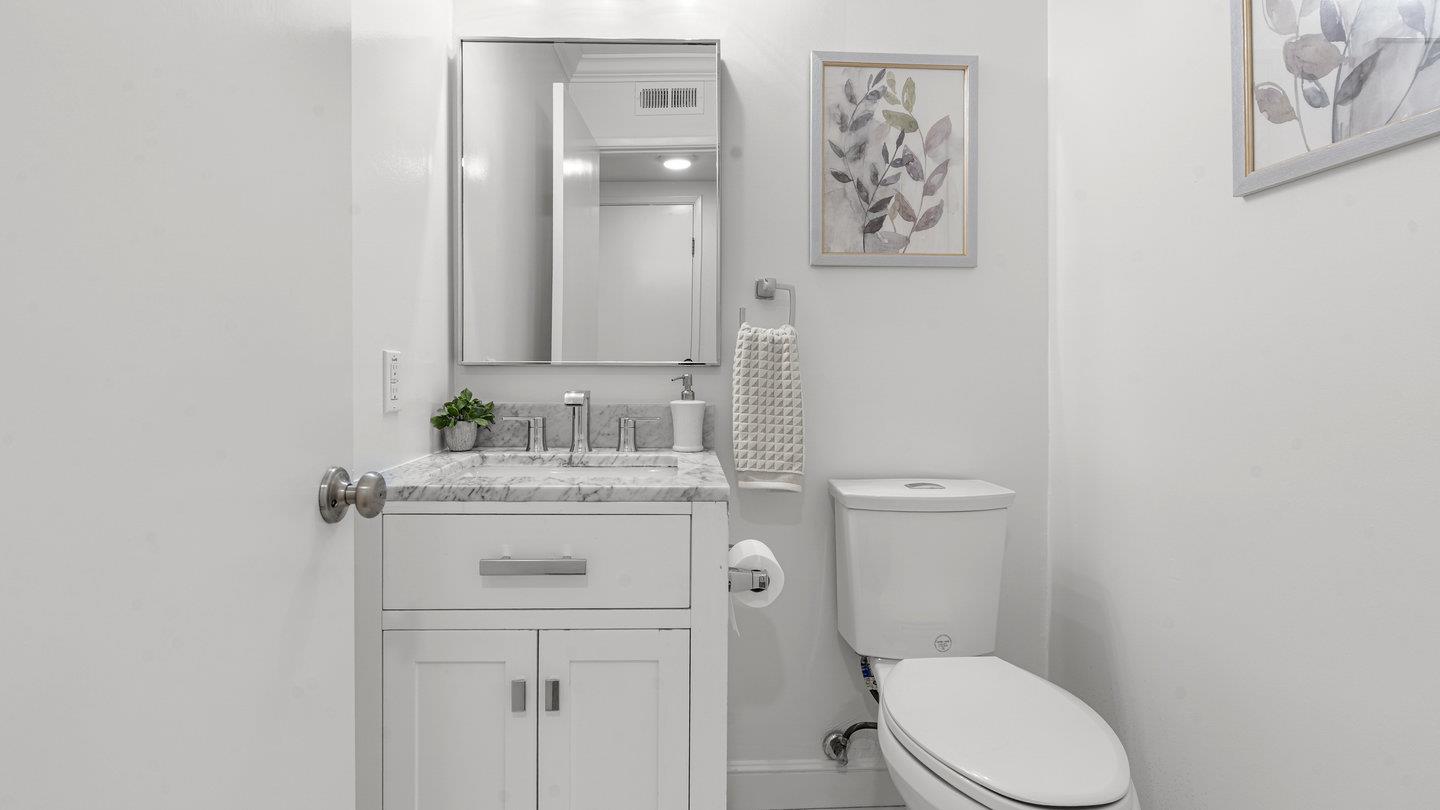 706 Celestial Lane Foster City, CA 94404 - Photo 14 of 36 a bathroom with a granite countertop toilet sink and mirror