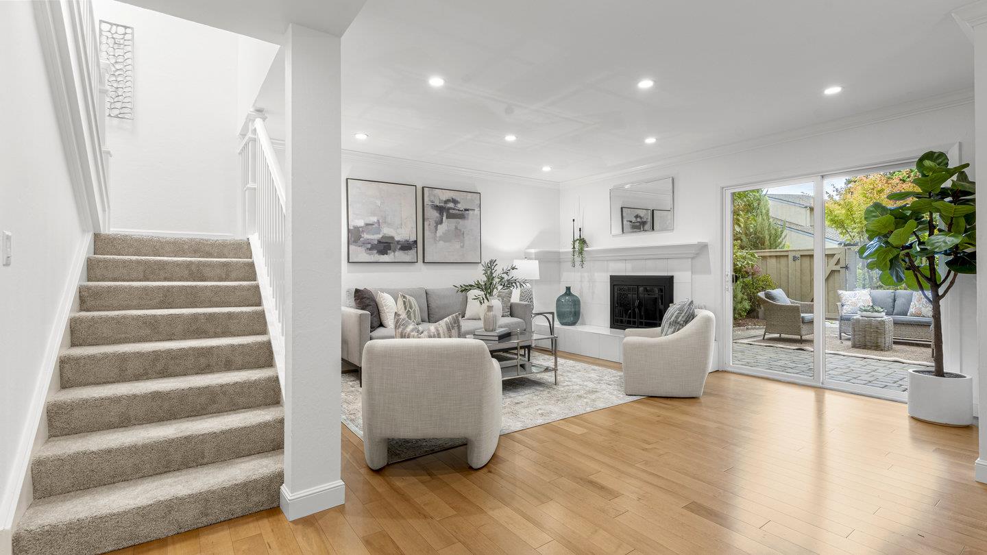 706 Celestial Lane Foster City, CA 94404 - Photo 15 of 36 a living room with furniture and a fireplace with wooden floor