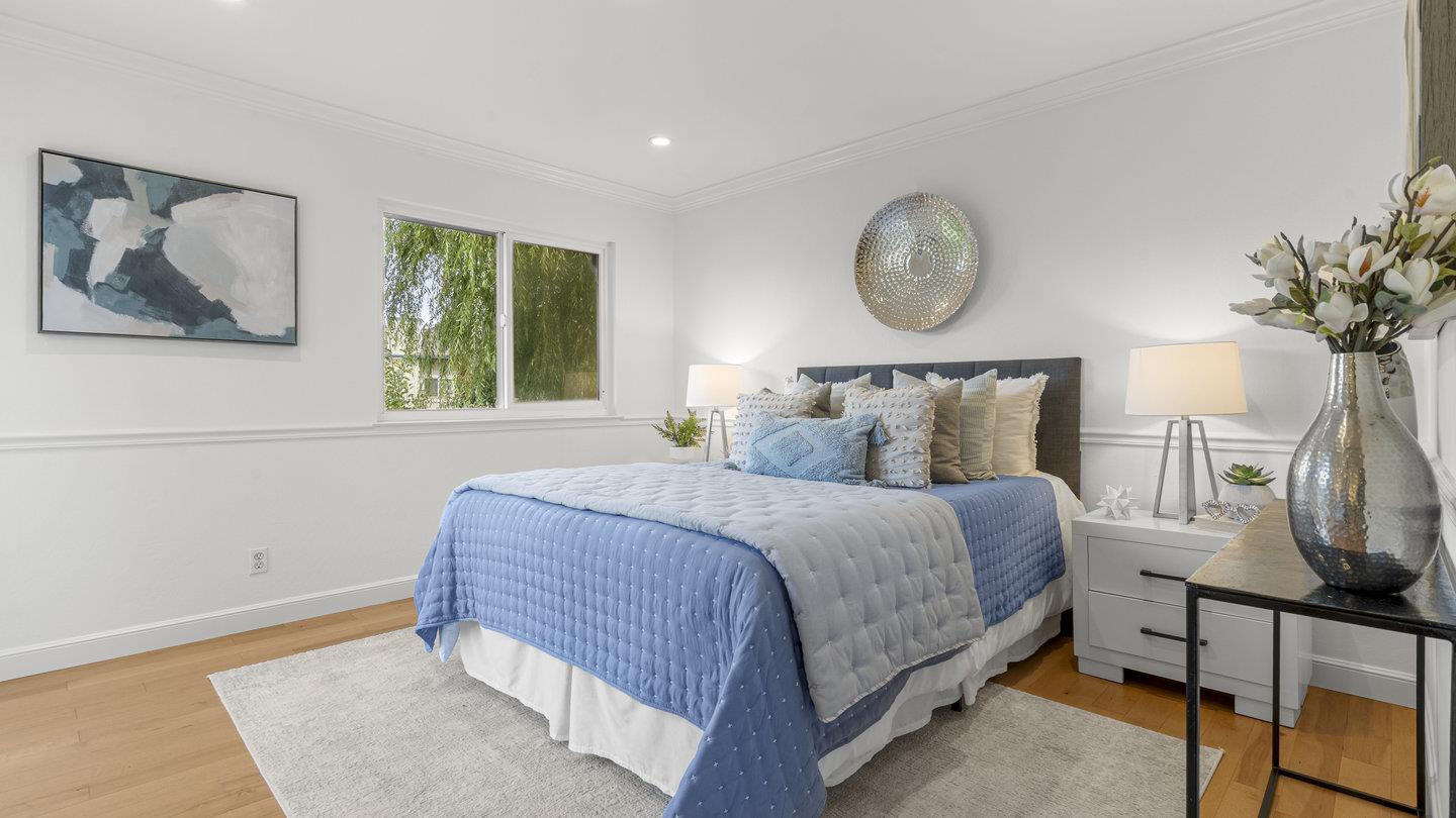 706 Celestial Lane Foster City, CA 94404 - Photo 16 of 36 a bedroom with a bed and a potted plant on the dresser