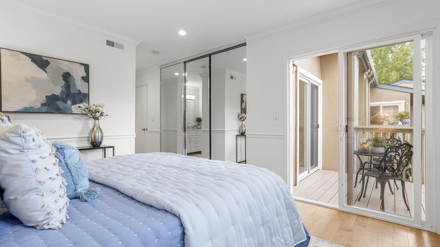 706 Celestial Lane Foster City, CA 94404 - Photo 19 of 36 a bedroom with a bed and a flat screen tv