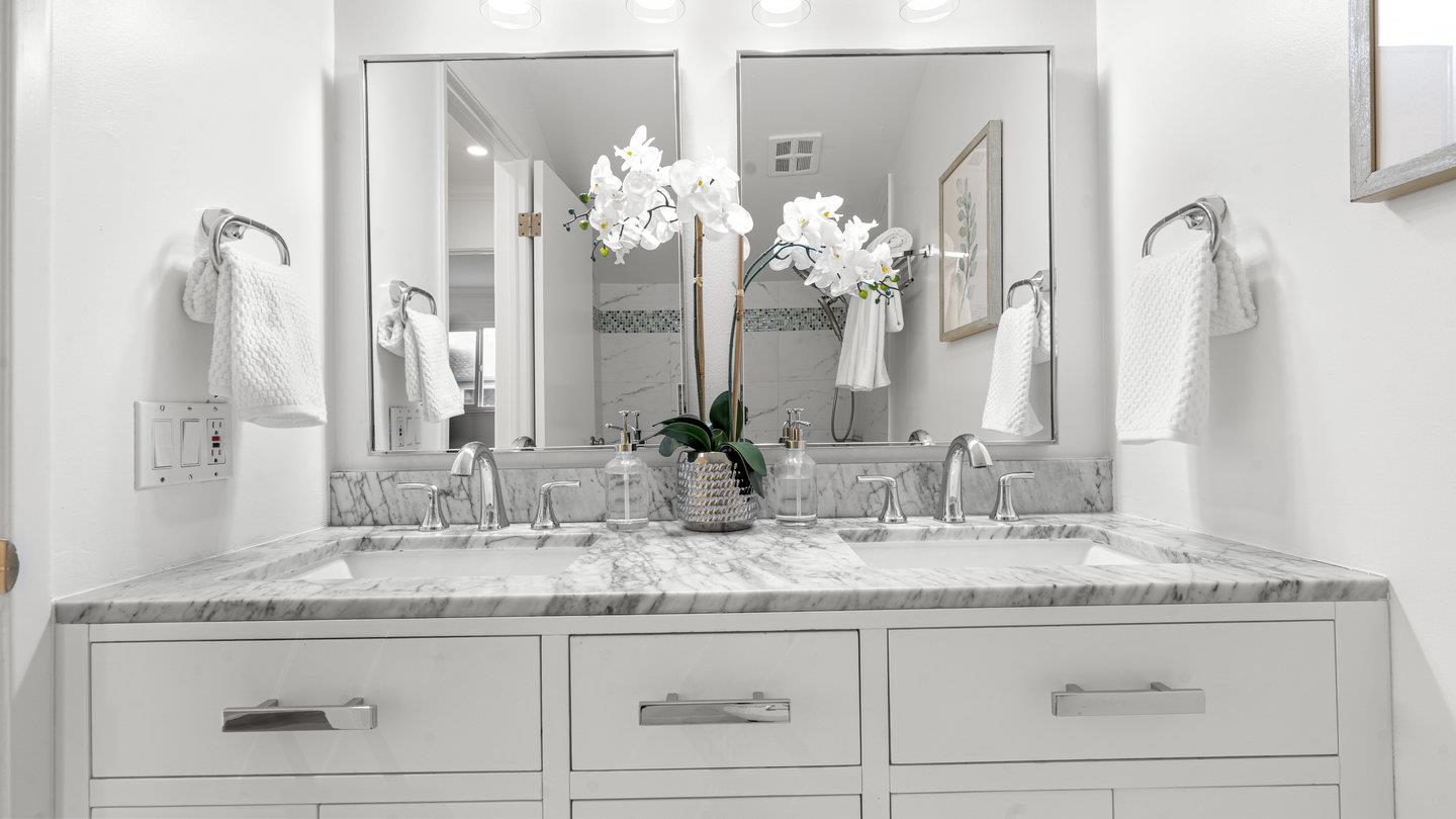706 Celestial Lane Foster City, CA 94404 - Photo 26 of 36 a bathroom with mirror sink and cabinets
