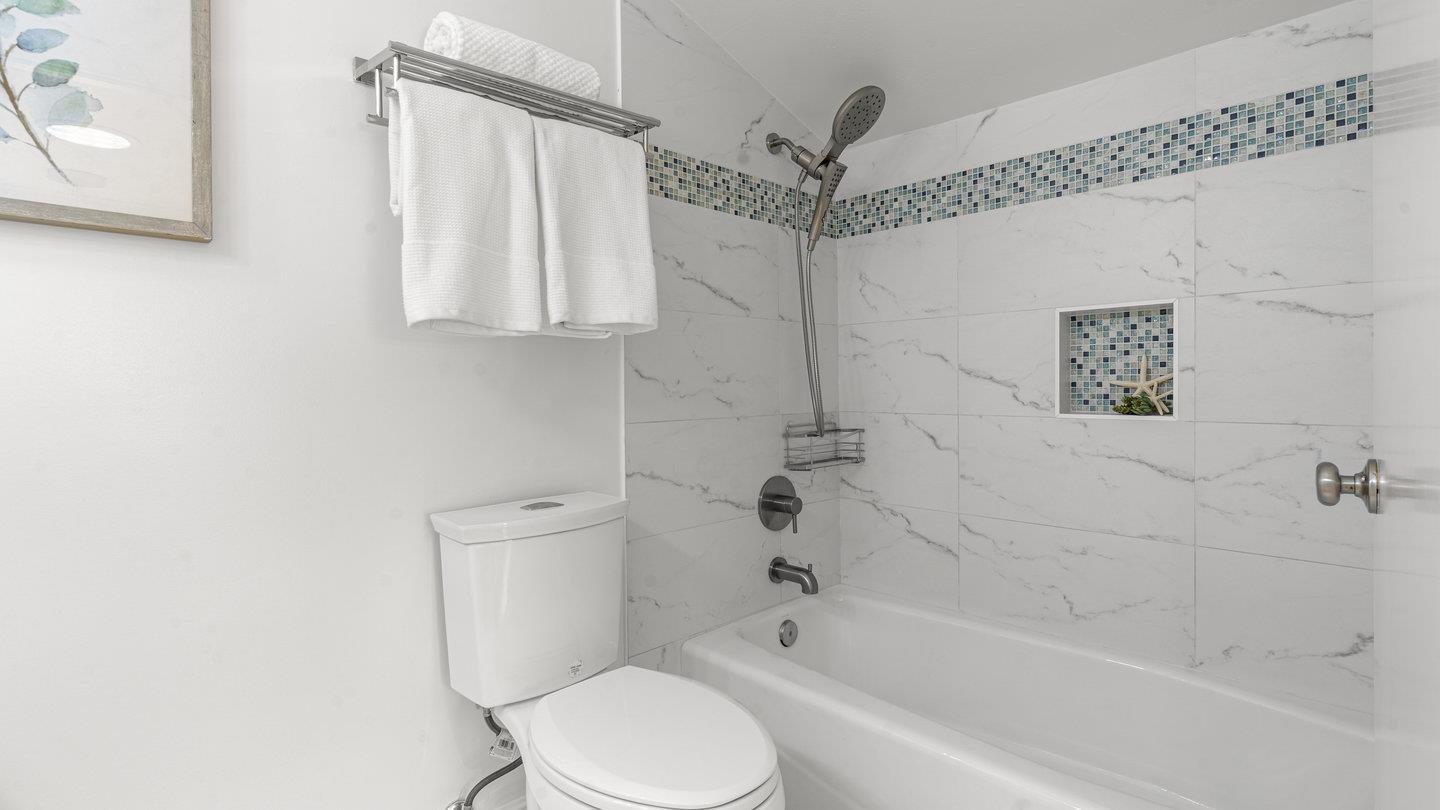 706 Celestial Lane Foster City, CA 94404 - Photo 27 of 36 a white toilet sitting next to a bath tub shower