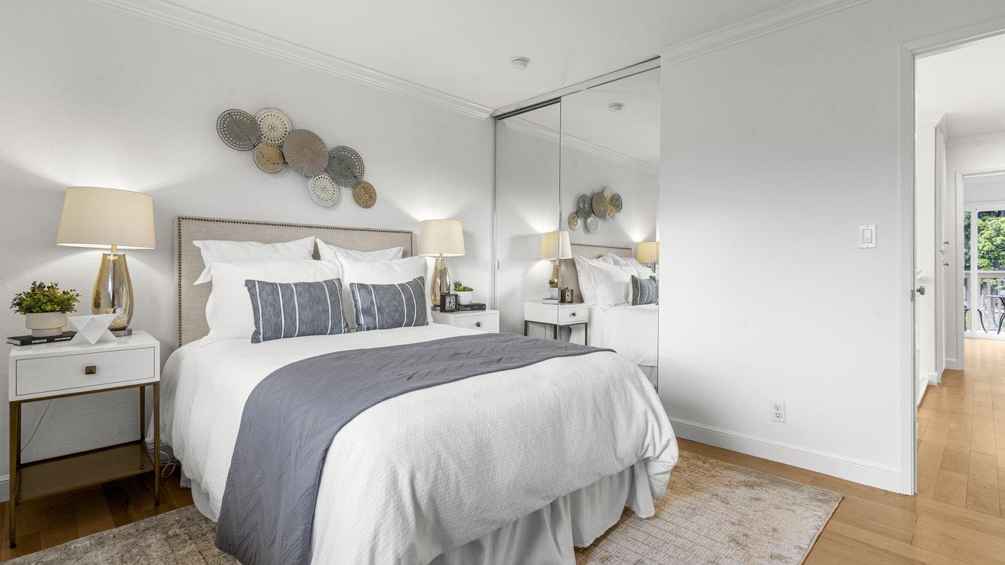 706 Celestial Lane Foster City, CA 94404 - Photo 29 of 36 a bed room with a bed mirror and a night stand