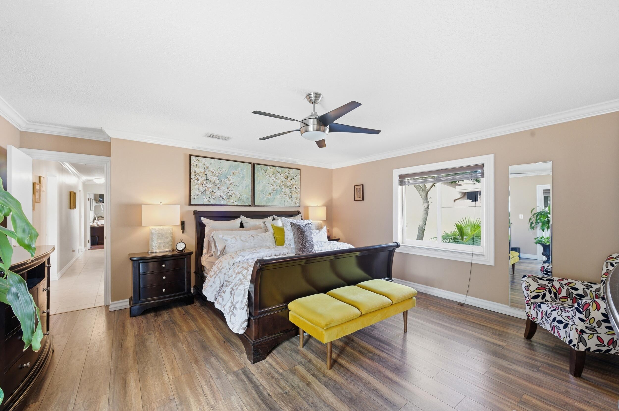 4780 Brandywine Drive Boca Raton, FL 33487 - Photo 16 of 43 a bed room with a bed and a chair