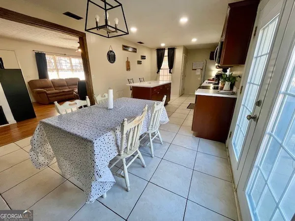 a view of a dining room with furniture and window