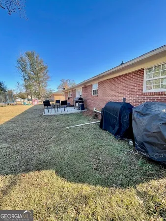 a view of a backyard with a sink and a yard