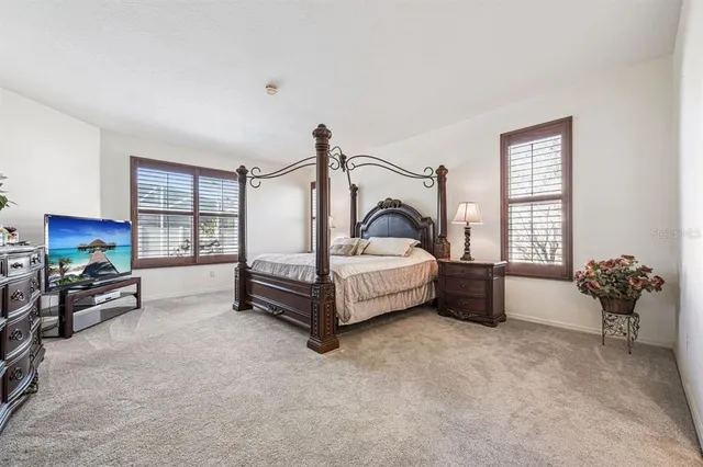 a spacious bathroom with a granite countertop sink mirror and shower