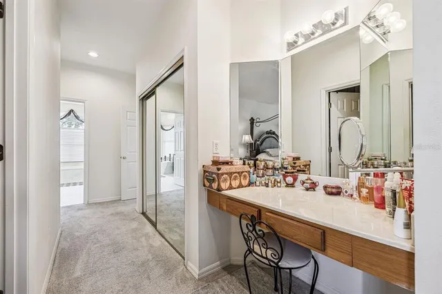 a bedroom with a bed lamp and window