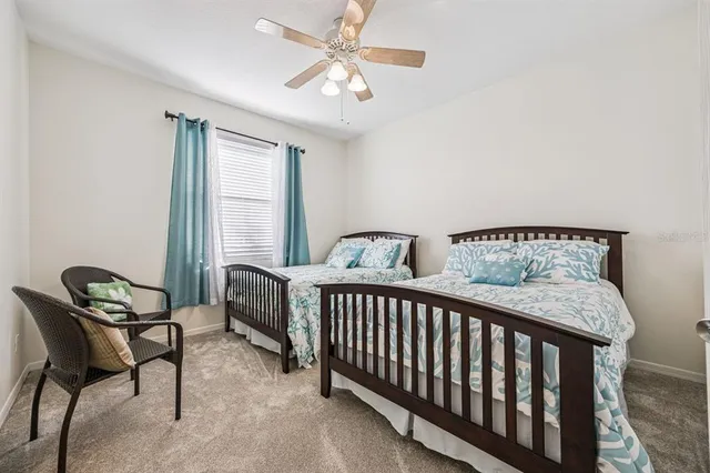 a utility room with cabinets washer and dryer