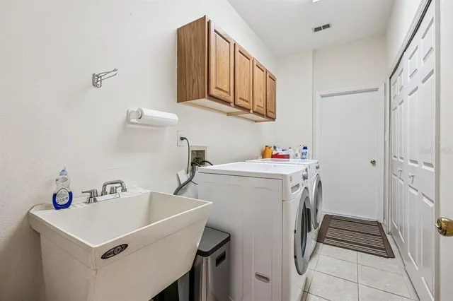 a dining room with furniture and floor to ceiling window