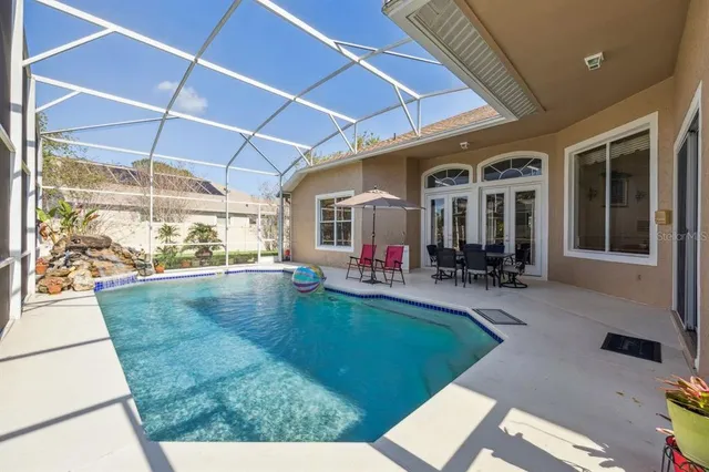 a view of a house with a yard and sitting area