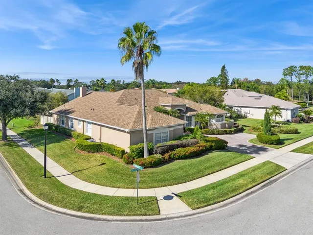 an aerial view of residential building with lake view