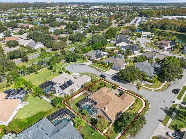 an aerial view of residential houses with outdoor space