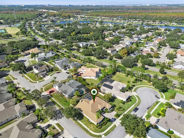 an aerial view of residential houses with outdoor space