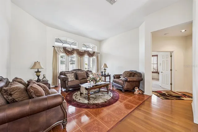 a living room with furniture and a large window