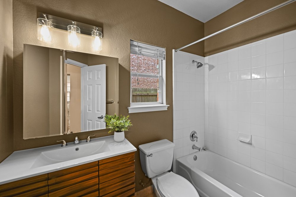 2823 Lantana Ridge Drive Austin, TX 78732 - Photo 16 of 34 a bathroom with a sink a toilet and shower
