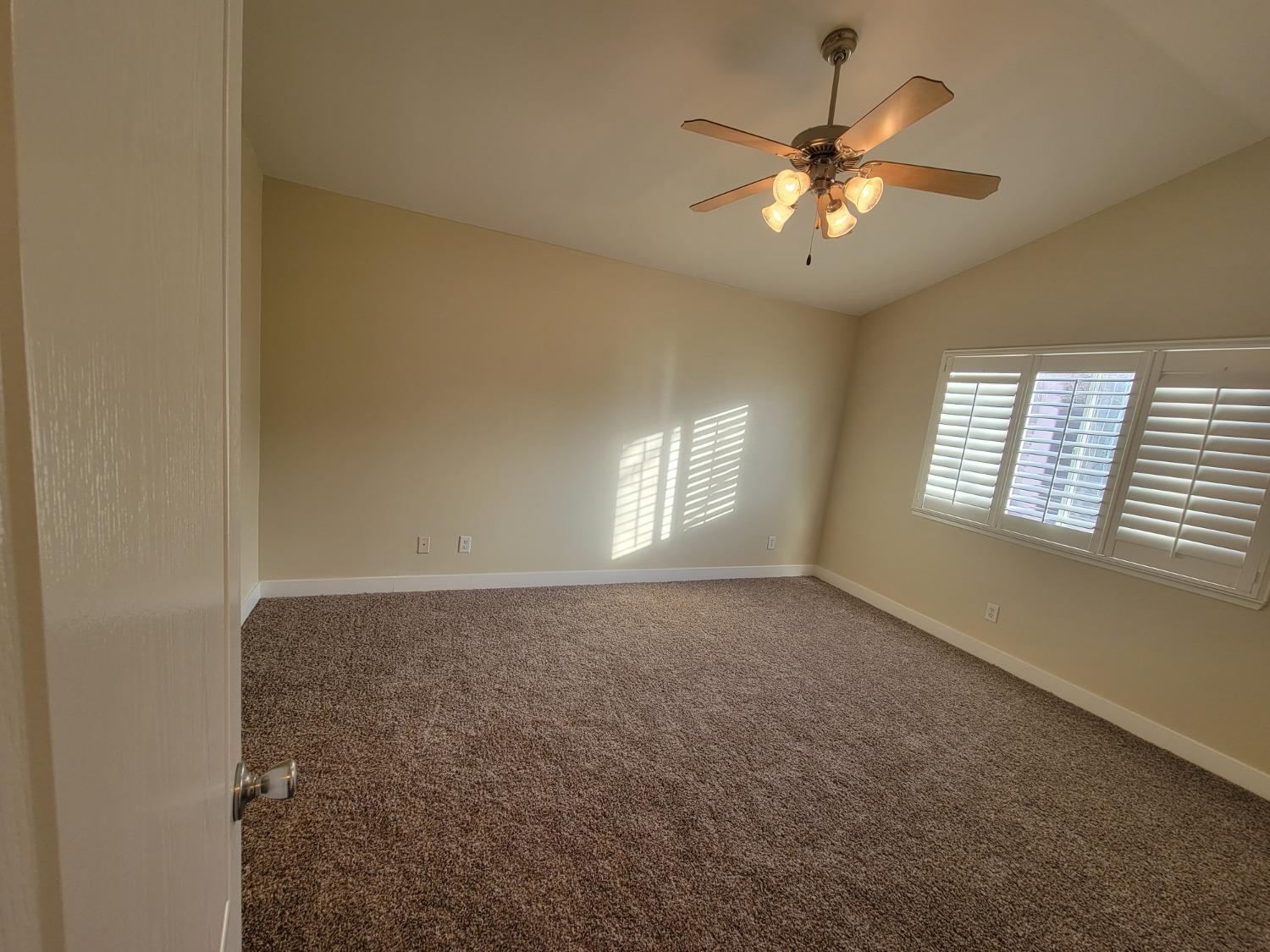 2831 Isabel Avenue Clovis, CA 93611 - Photo 11 of 27 a view of an empty room with a window