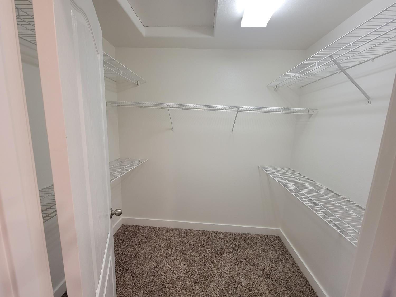 2831 Isabel Avenue Clovis, CA 93611 - Photo 14 of 27 a view of a room with racks on the wall