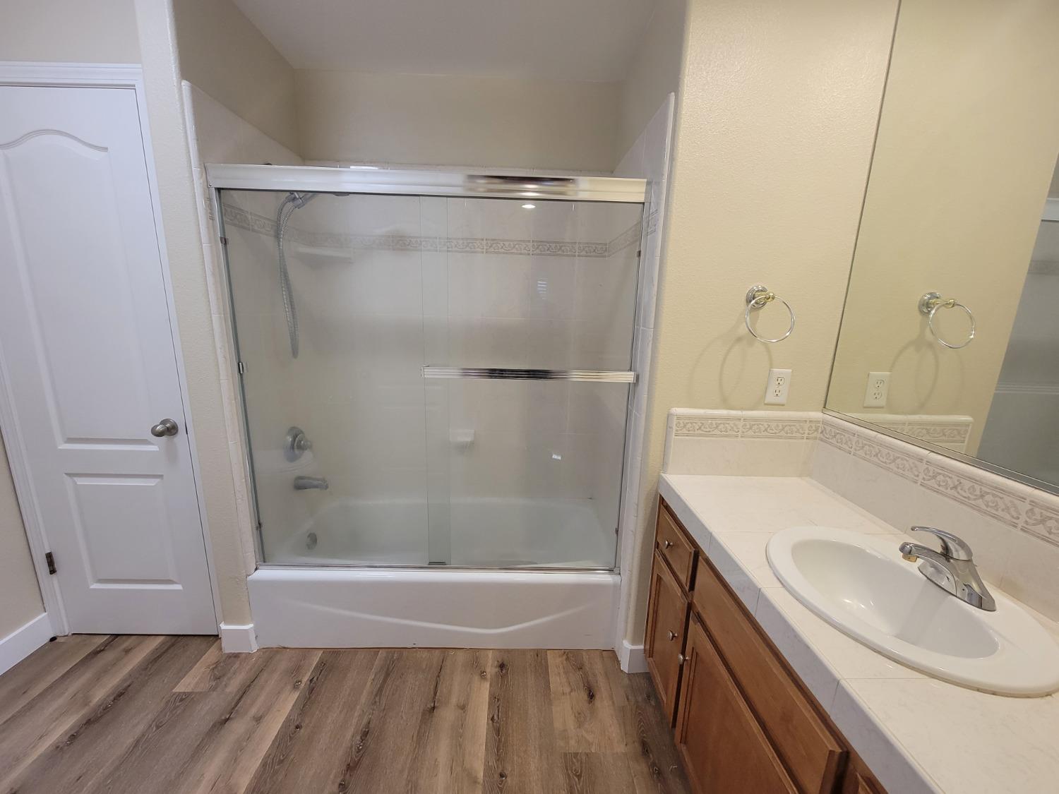 2831 Isabel Avenue Clovis, CA 93611 - Photo 19 of 27 a bathroom with a sink and a mirror