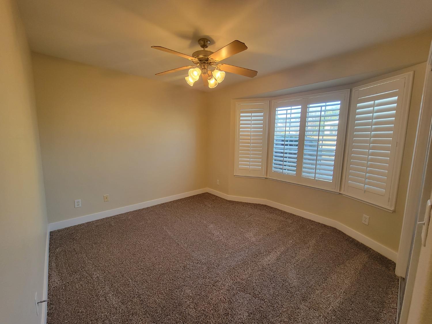 2831 Isabel Avenue Clovis, CA 93611 - Photo 22 of 27 a view of an empty room with a window
