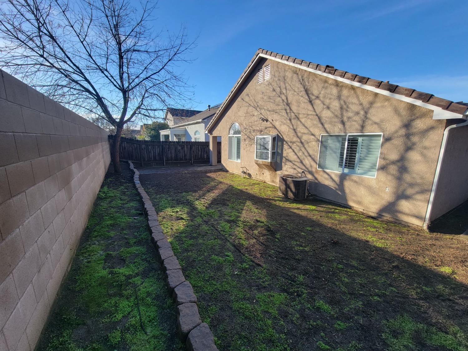 2831 Isabel Avenue Clovis, CA 93611 - Photo 27 of 27 a view of a house with a yard