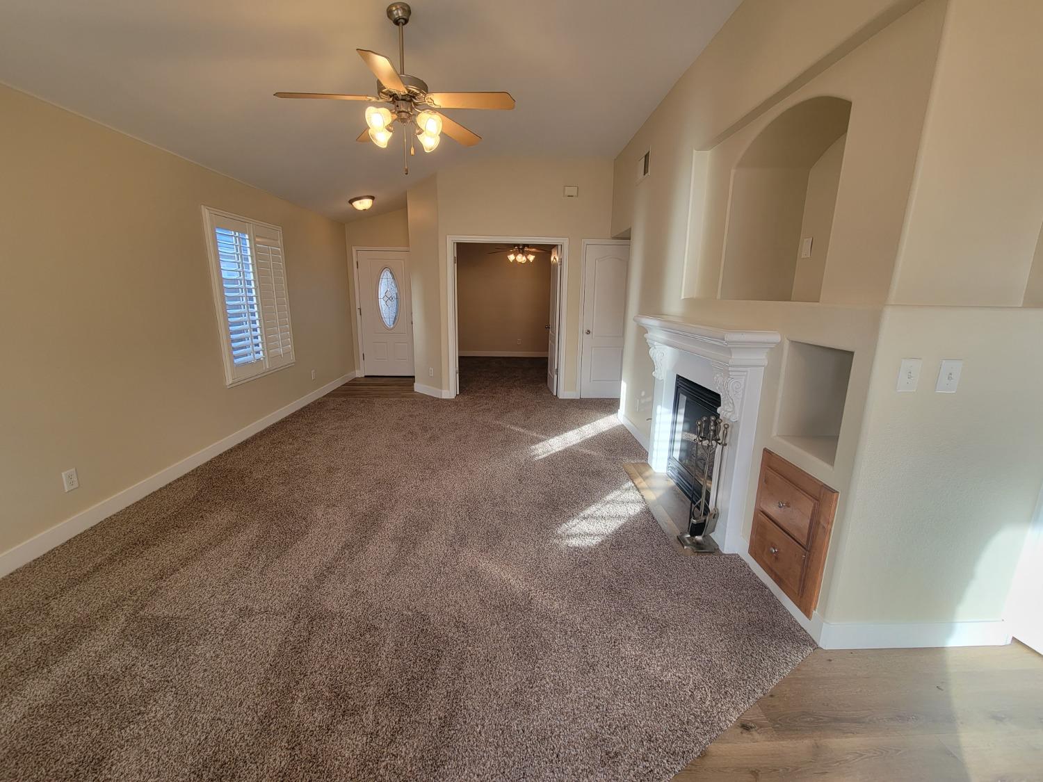 2831 Isabel Avenue Clovis, CA 93611 - Photo 6 of 27 a view of empty room with a fireplace