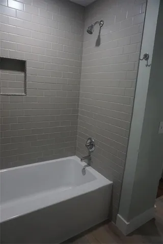 a white bath tub sitting in a bathroom