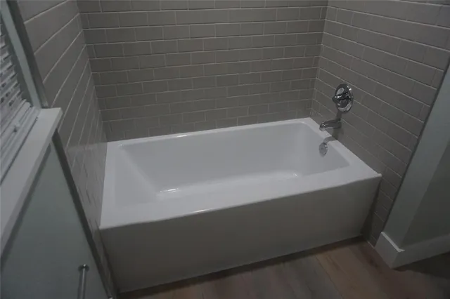 a bath tub sitting in a bathroom