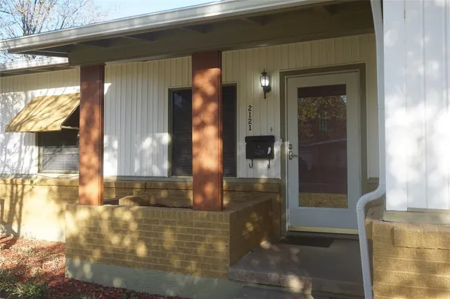 a bathroom with a glass door shower