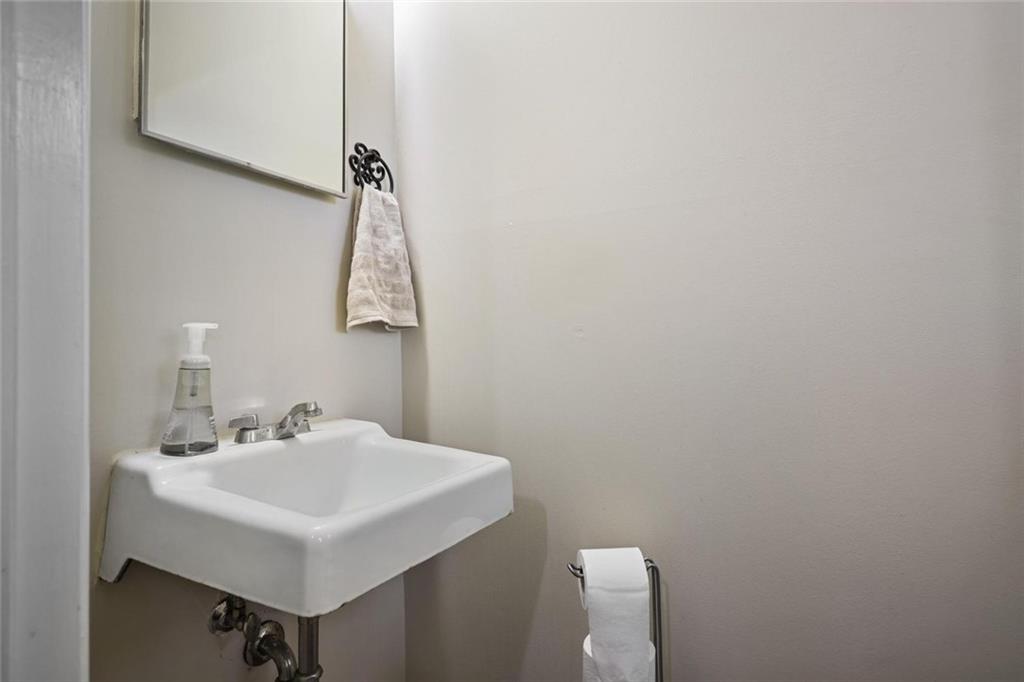 4505 Cochran Mill Road Fairburn, GA 30213 - Photo 18 of 36 a bathroom with a sink and a mirror