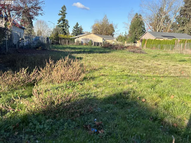a view of a lake with houses in the back