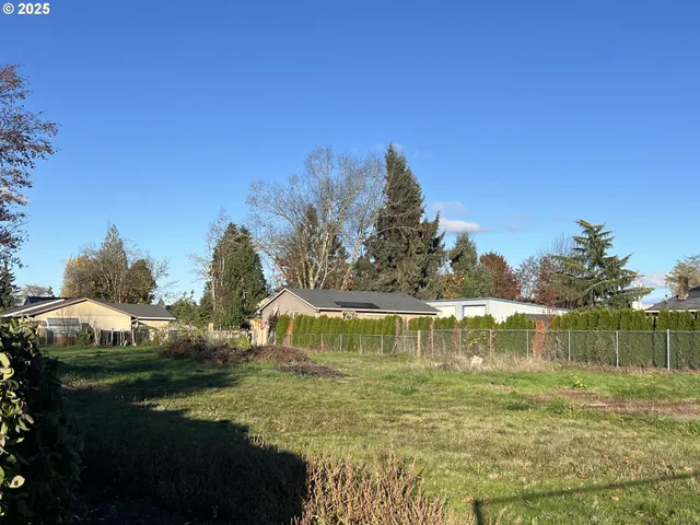 a view of a lake with houses in the background