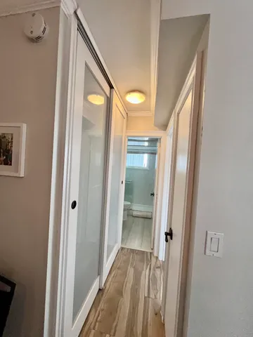 a bathroom with a glass door shower and a sink