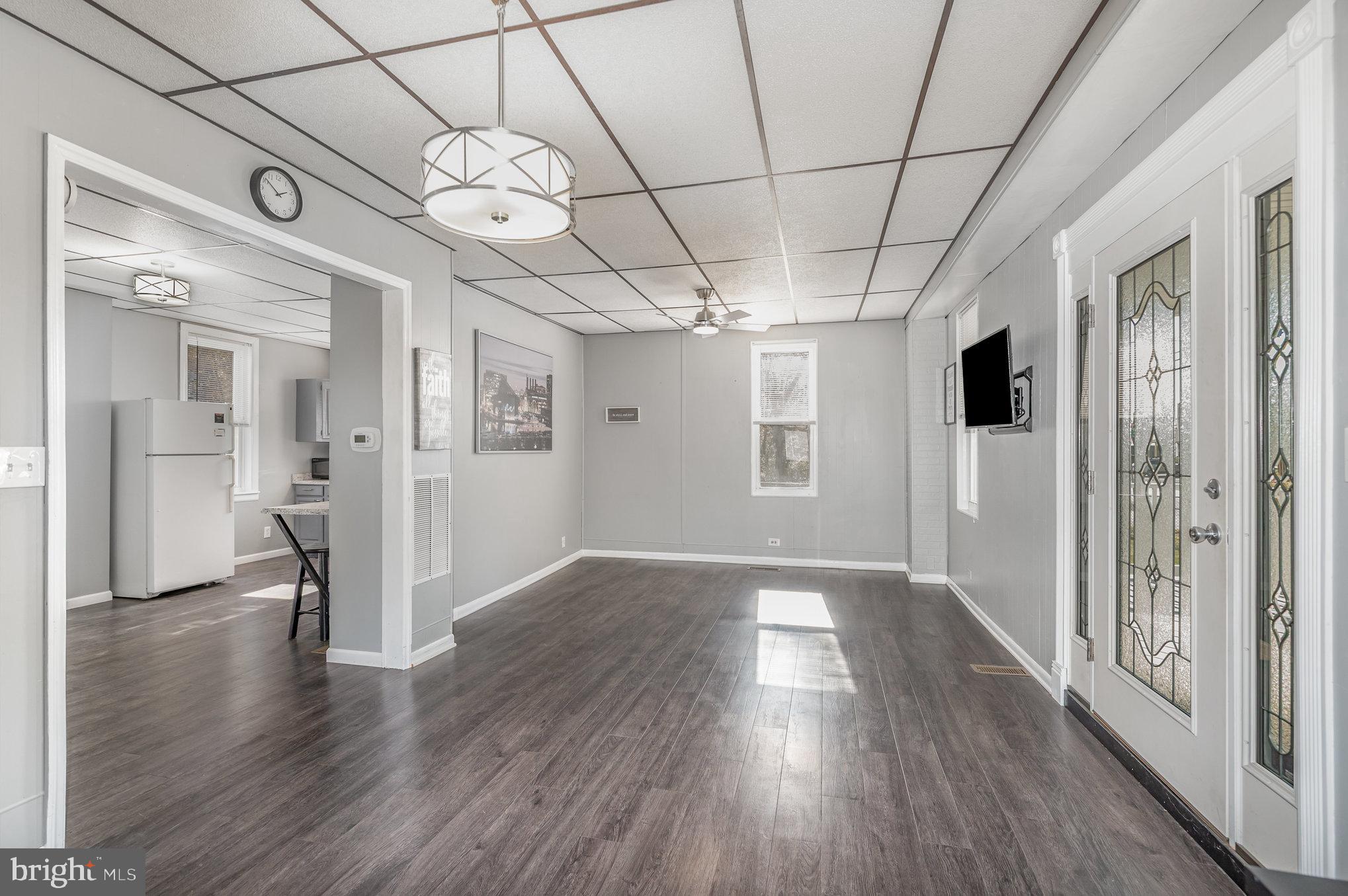 2703 Sparrows Point Road Baltimore, MD 21219 - Photo 4 of 24 a view of a hallway with wooden floor and a large window