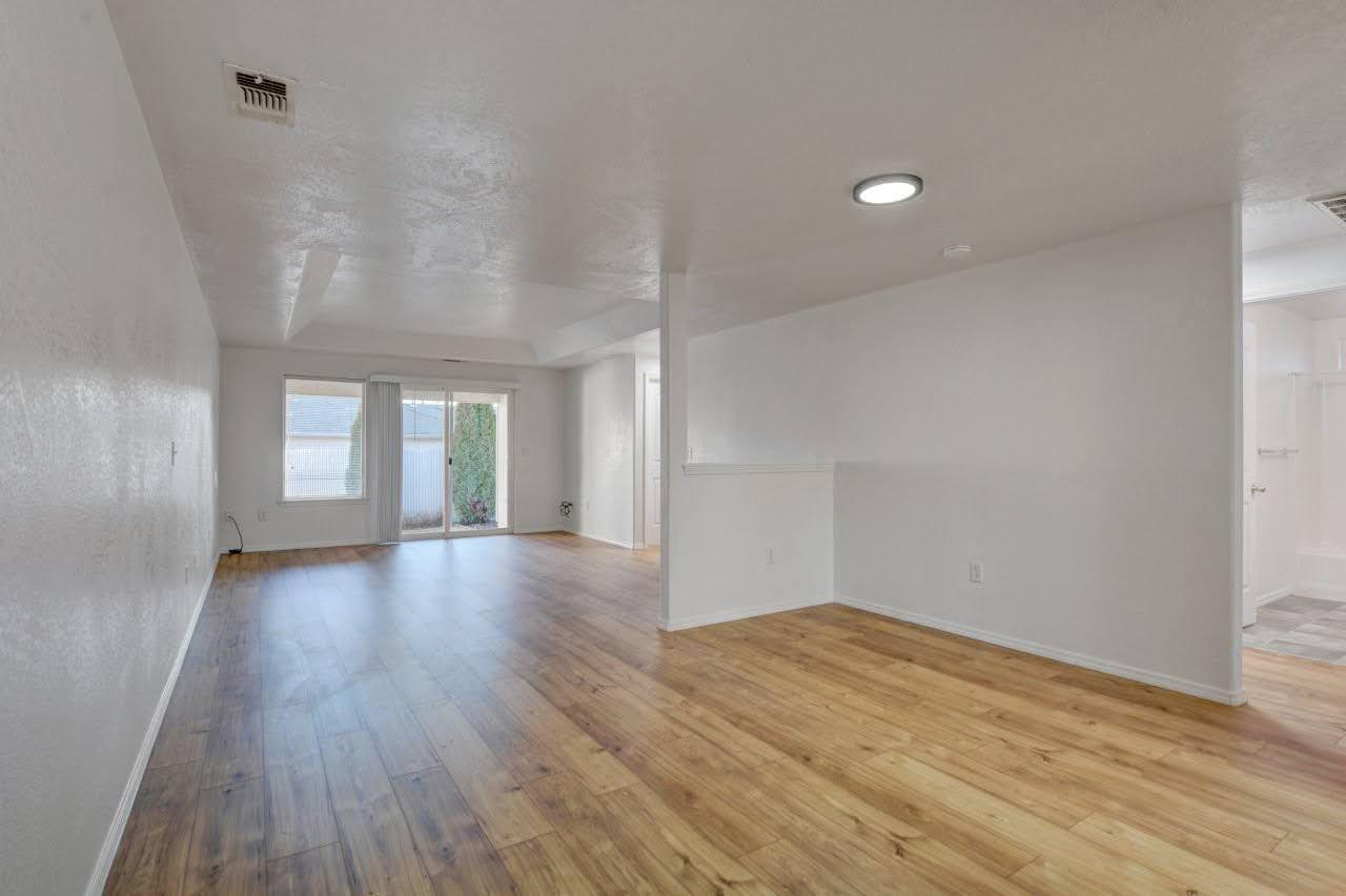 417 Crystal Drive Eagle Point, OR 97524 - Photo 9 of 35 wooden floor in an empty room with a window