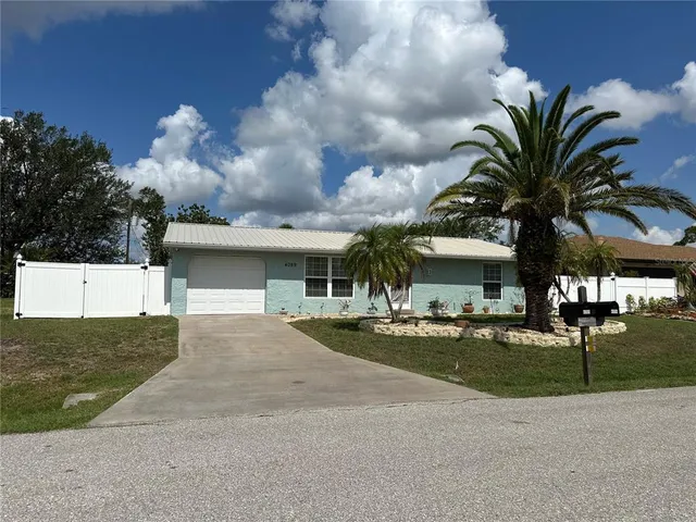 a view of a lake with houses in the background