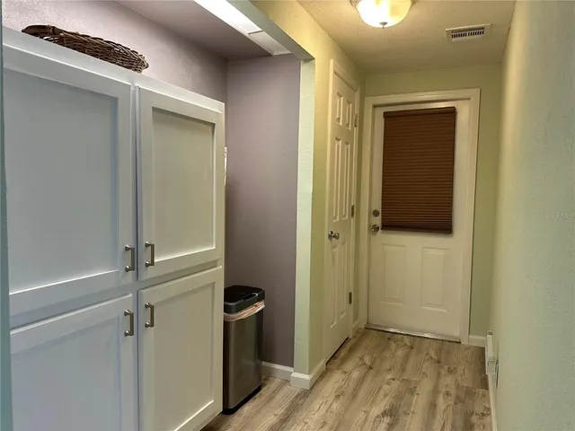 a view of a backyard with swimming pool