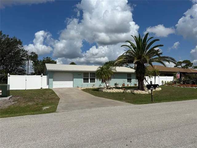 a view of a tree with a yard