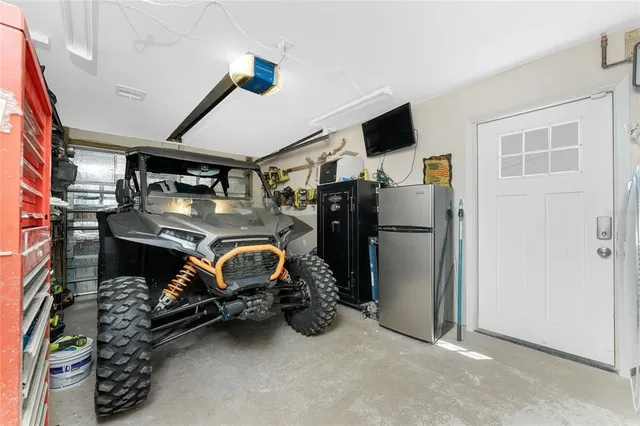 a front view of a house with garden and parking