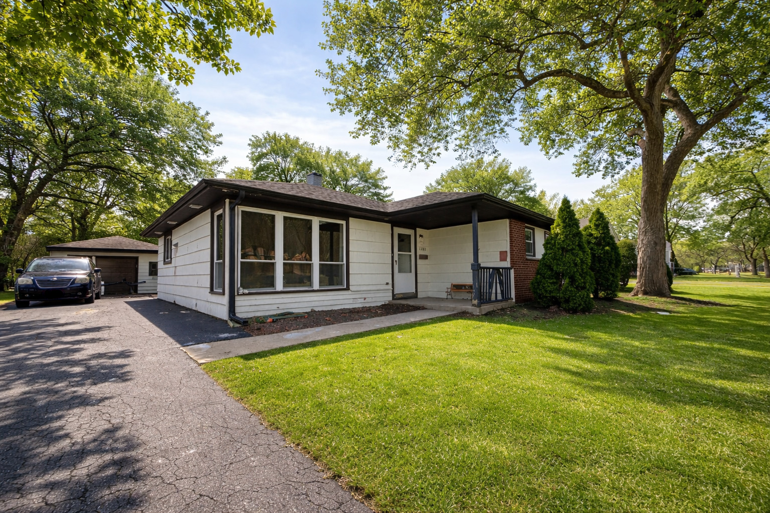 2109 Park Street Rolling Meadows, IL 60008 - Photo 2 of 19 a front view of a house with a yard and trees