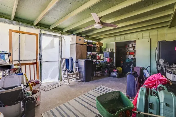 a view of gym equipment and windows in a room