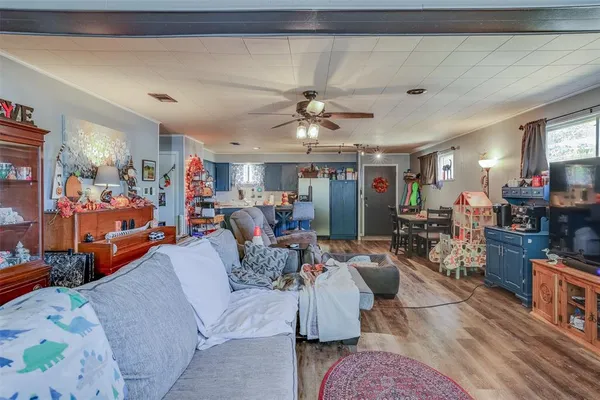 a living room with lots of furniture and a chandelier