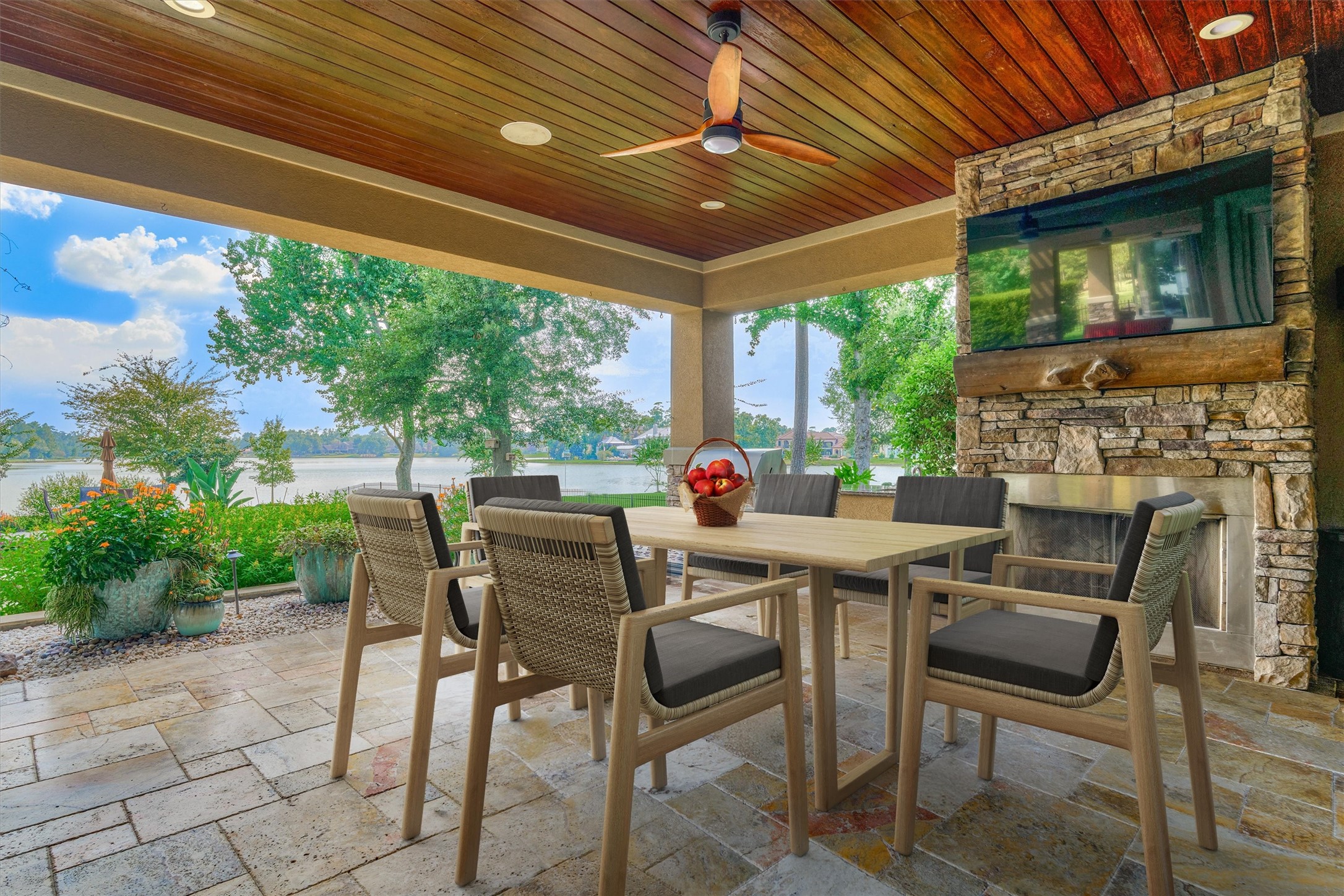 5402 White Birch Run Spring, TX 77386 - Photo 15 of 27 Gas fireplace in covered exterior dining room with 65" television (conveys) & surround sound.