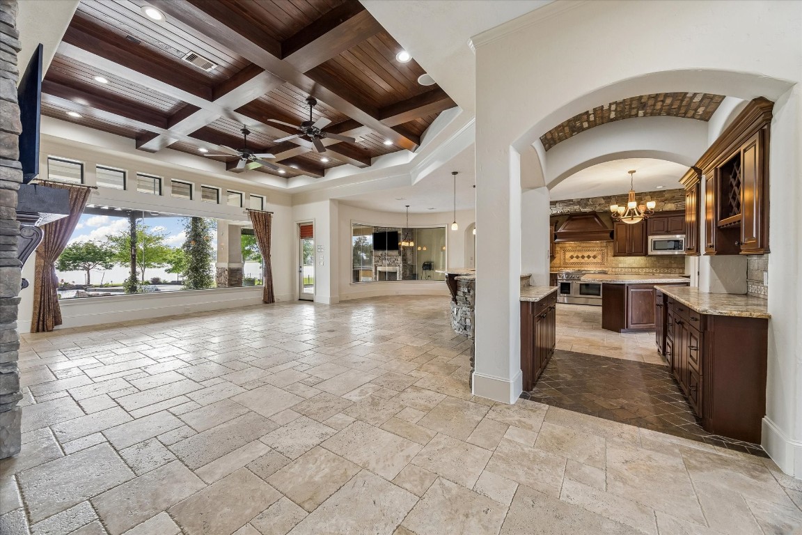 5402 White Birch Run Spring, TX 77386 - Photo 18 of 43 a view of a hallway with dining area and chandelier