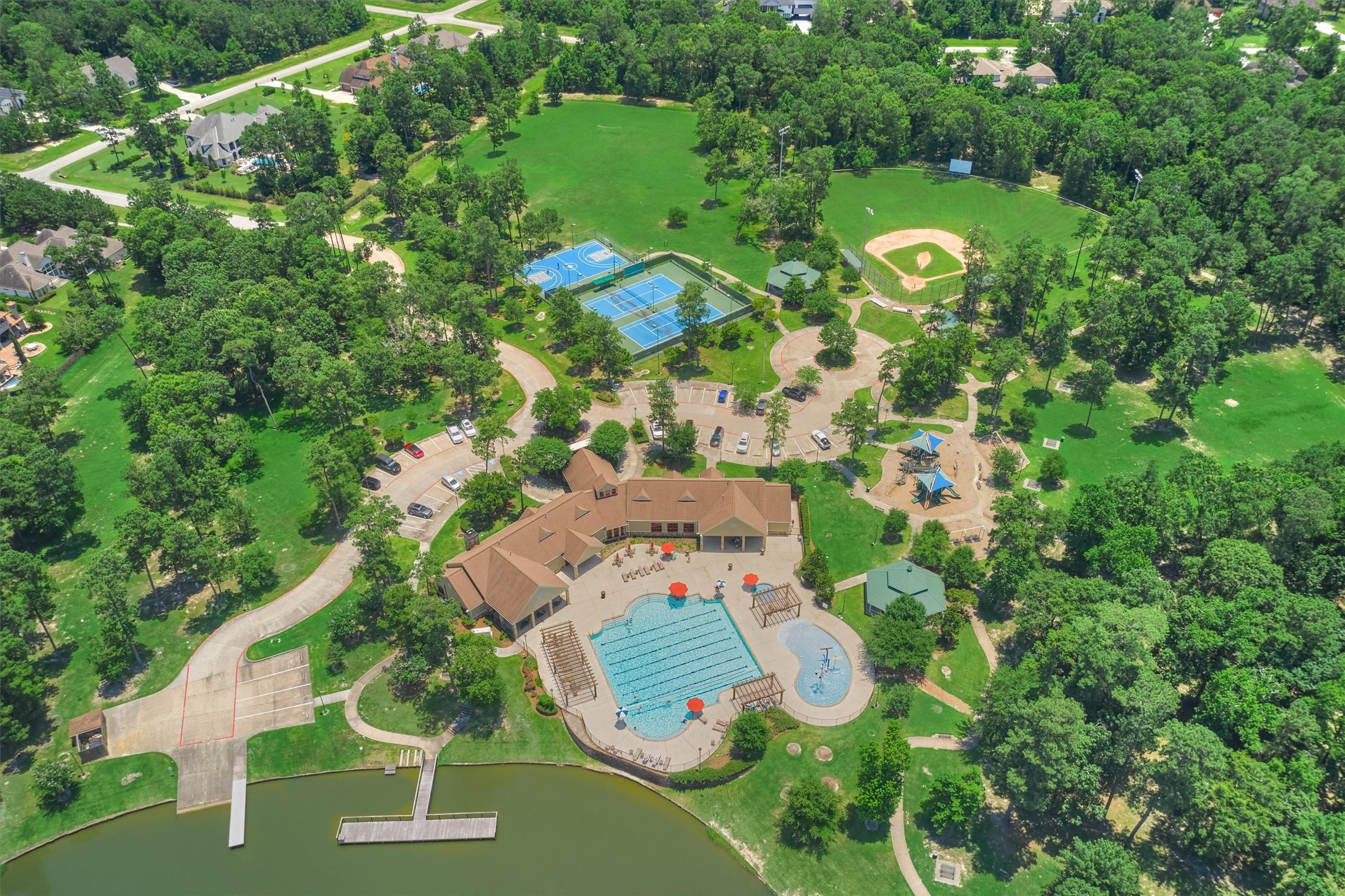 5402 White Birch Run Spring, TX 77386 - Photo 20 of 27 Benders Landing clubhouse with fitness center, banquet/meeting room, pool, splash pad, basketball court, tennis/pickleball courts, baseball & soccer fields, playground, boat dock.