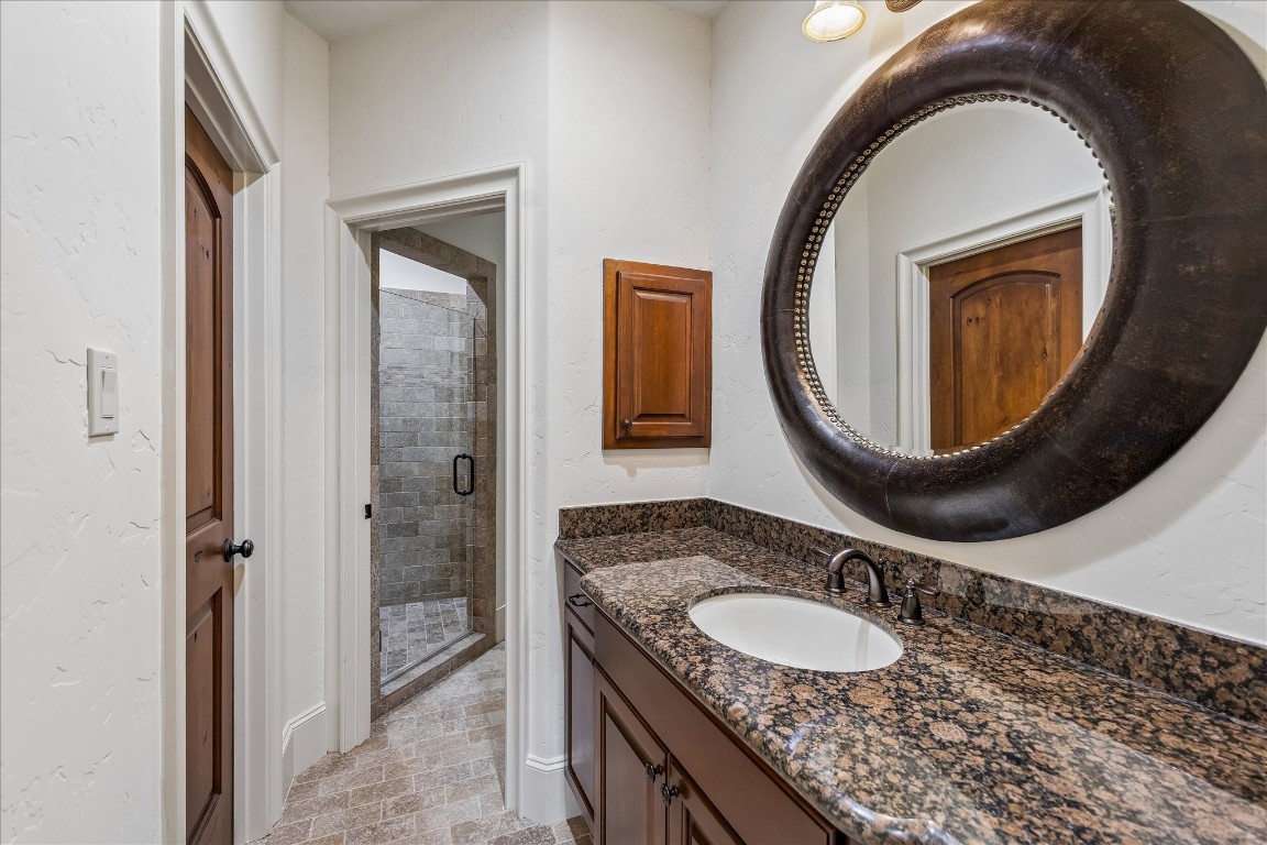 5402 White Birch Run Spring, TX 77386 - Photo 31 of 43 a bathroom with a granite countertop sink a mirror and a toilet