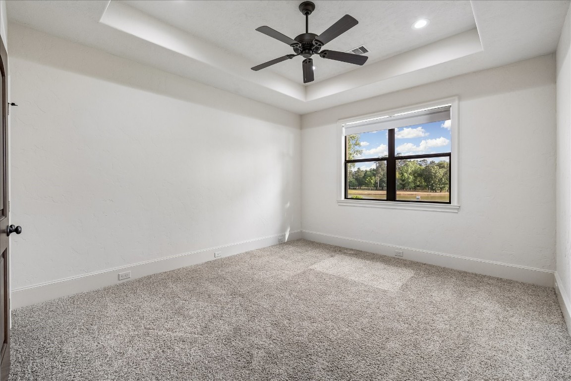 5402 White Birch Run Spring, TX 77386 - Photo 32 of 43 an empty room with a window and a ceiling fan